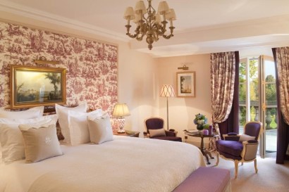 A double bedroom at Relais et Chateaux Auberge du Jeu de Paume, Chantilly