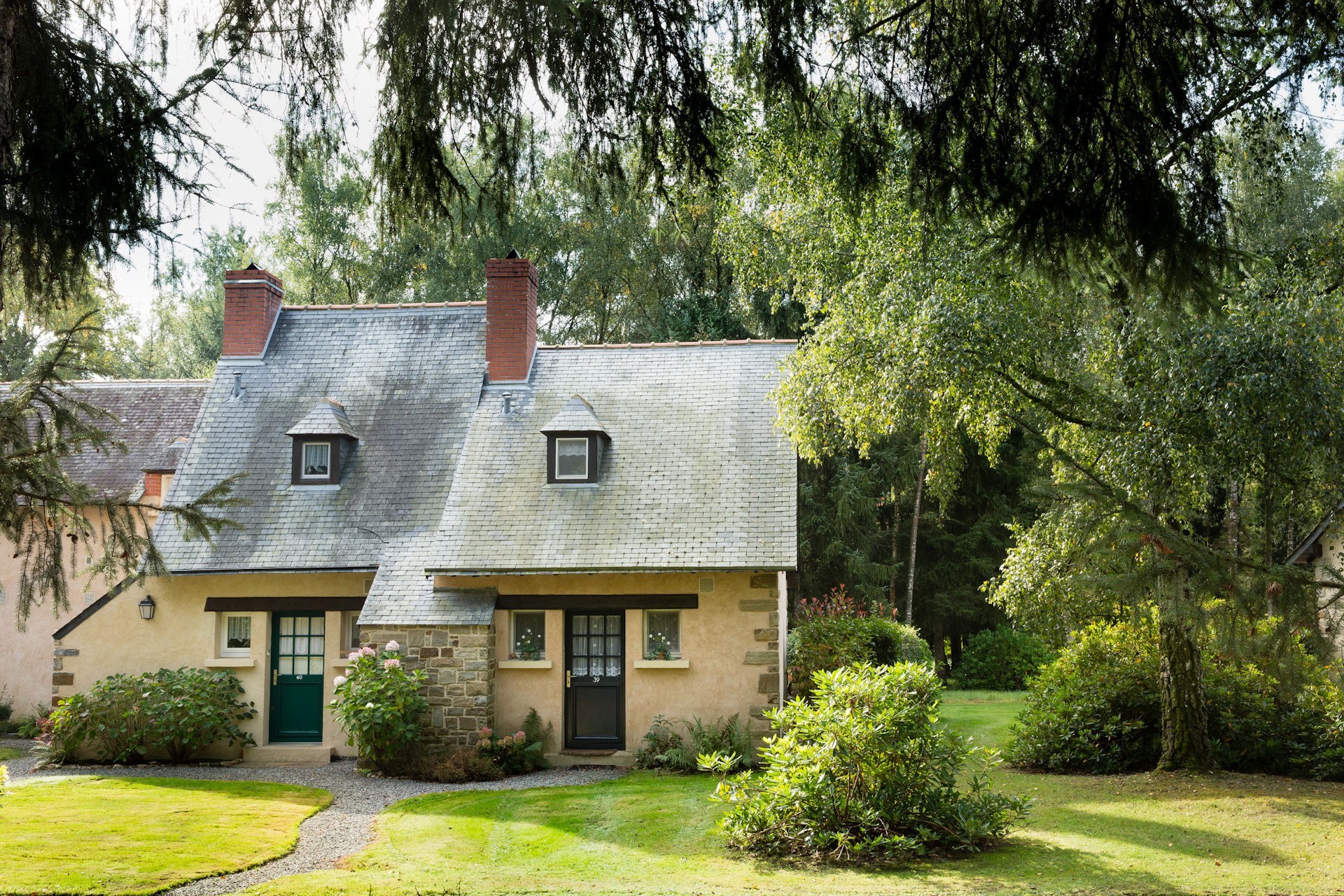 Cottages set in the forest at Domaine de la Bretesche, Brittany, France