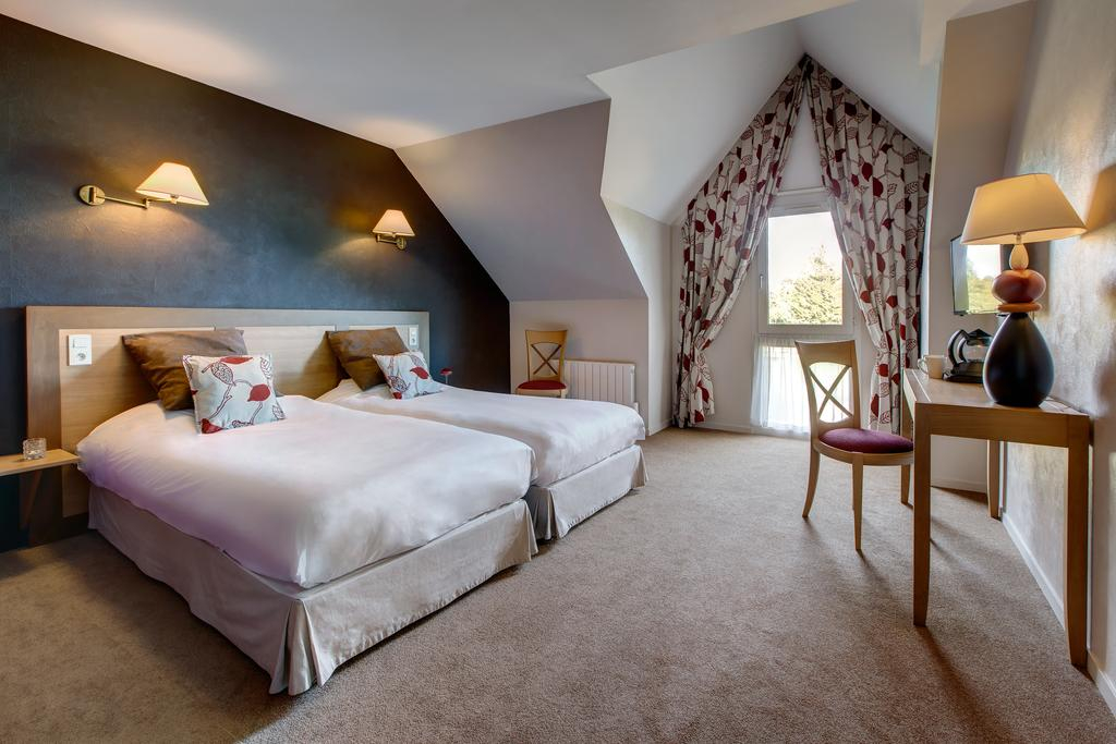 A large double room at Domaine des Ormes, near St Malo, Brittany, France. Golf Planet Holidays.