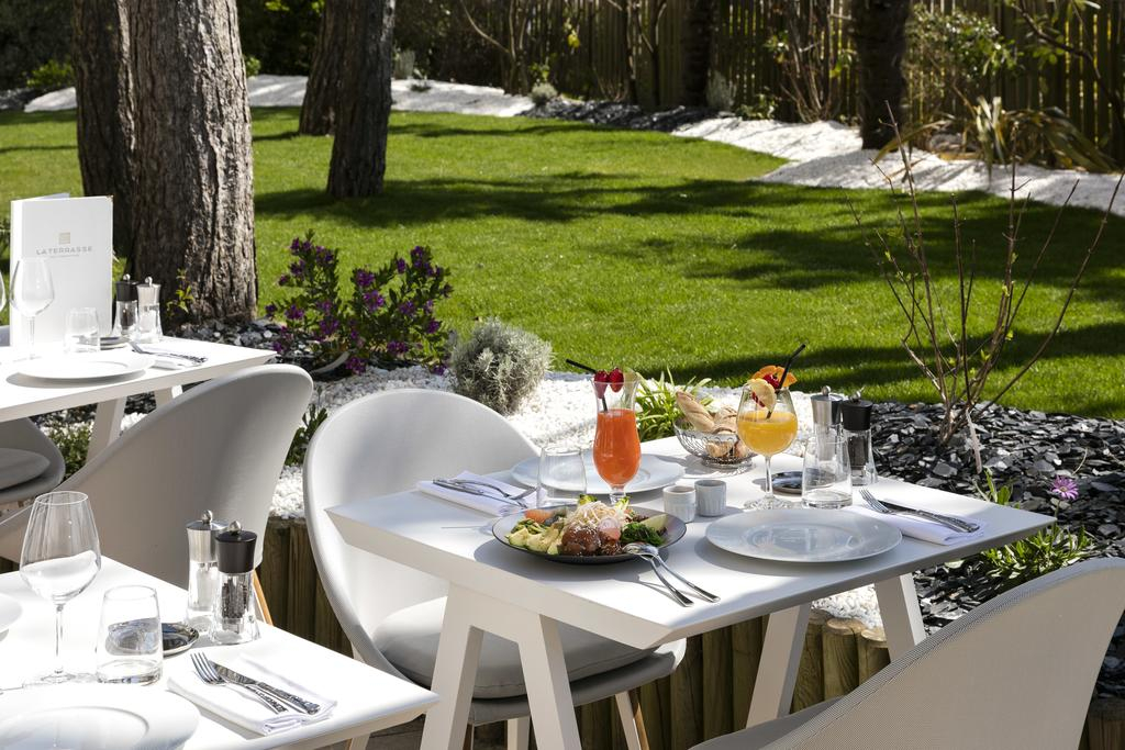 Dine on the terrace at Hotel Barriere lâ€™Hermitage, La Baule, Brittany, France