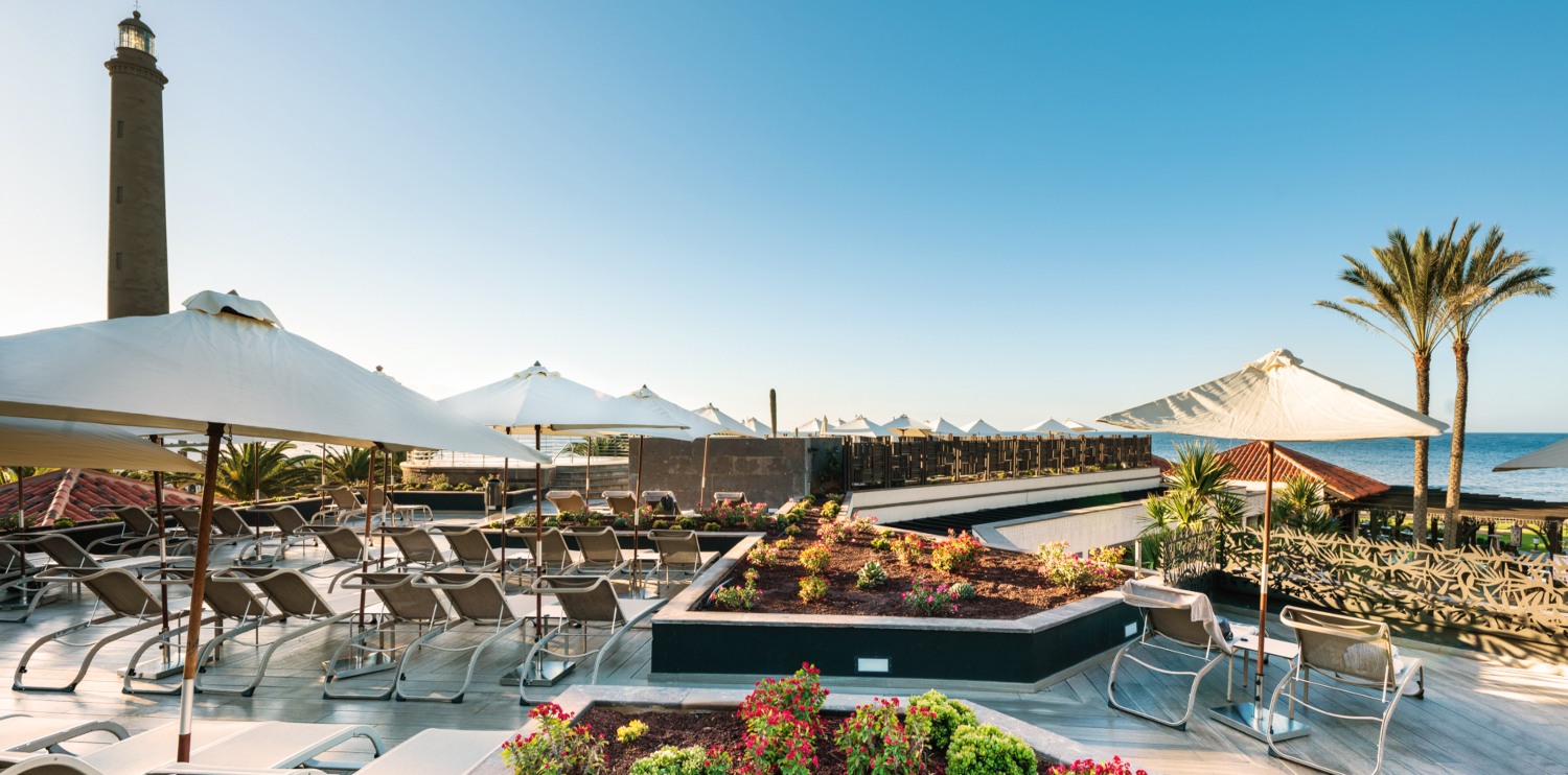 Sunloungers overlooking the ocean at Lopesan Costa Meloneras, Gran Canaria, Canary Islands