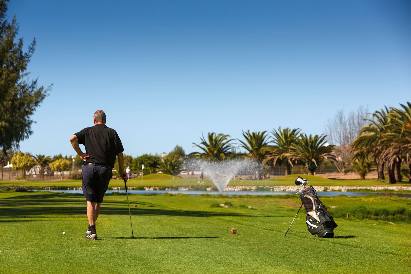 Golfer waits their turn at Maspalomas Golf Club, Gran Canaria, Canary Islands