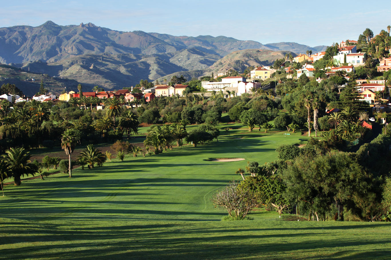 Playing down the fairway to the green at Real Las Palmas Golf Club, Gran Canaria, Canary Islands