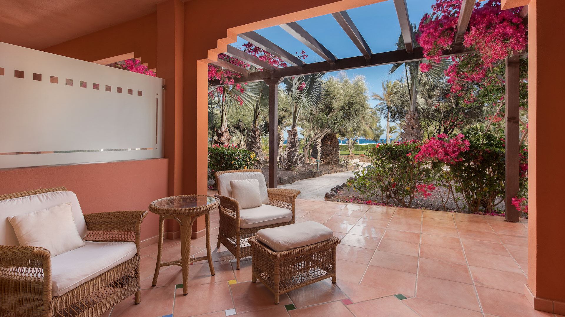 A deluxe bedroom terrace with sea view at Sheraton Fuerteventura Beach Golf and Spa Resort