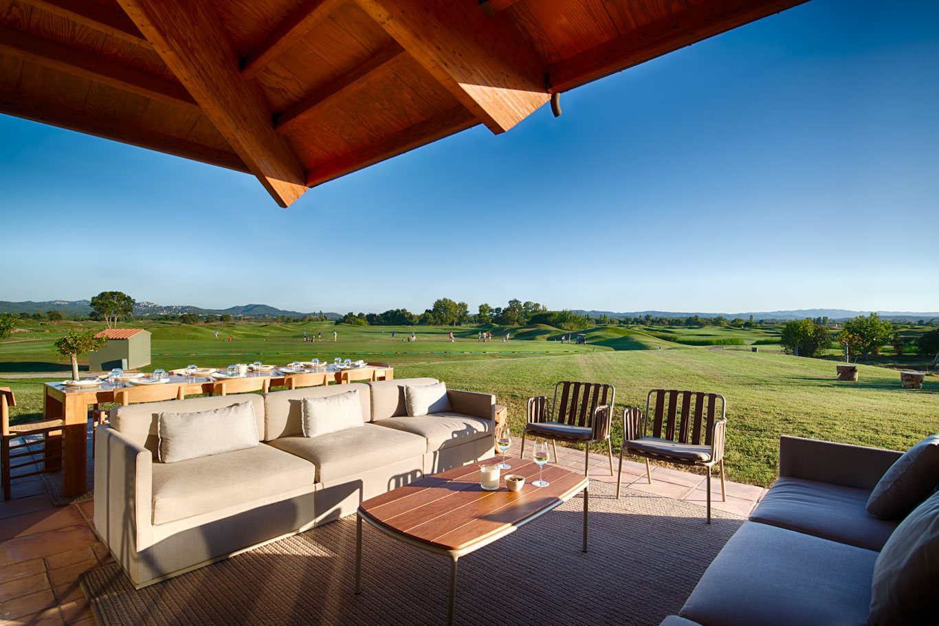 Enjoy a friendly drink outside at Hotel Terraverda at Emporda Golf Girona, Costa Brava, Spain, overlooking the golf course