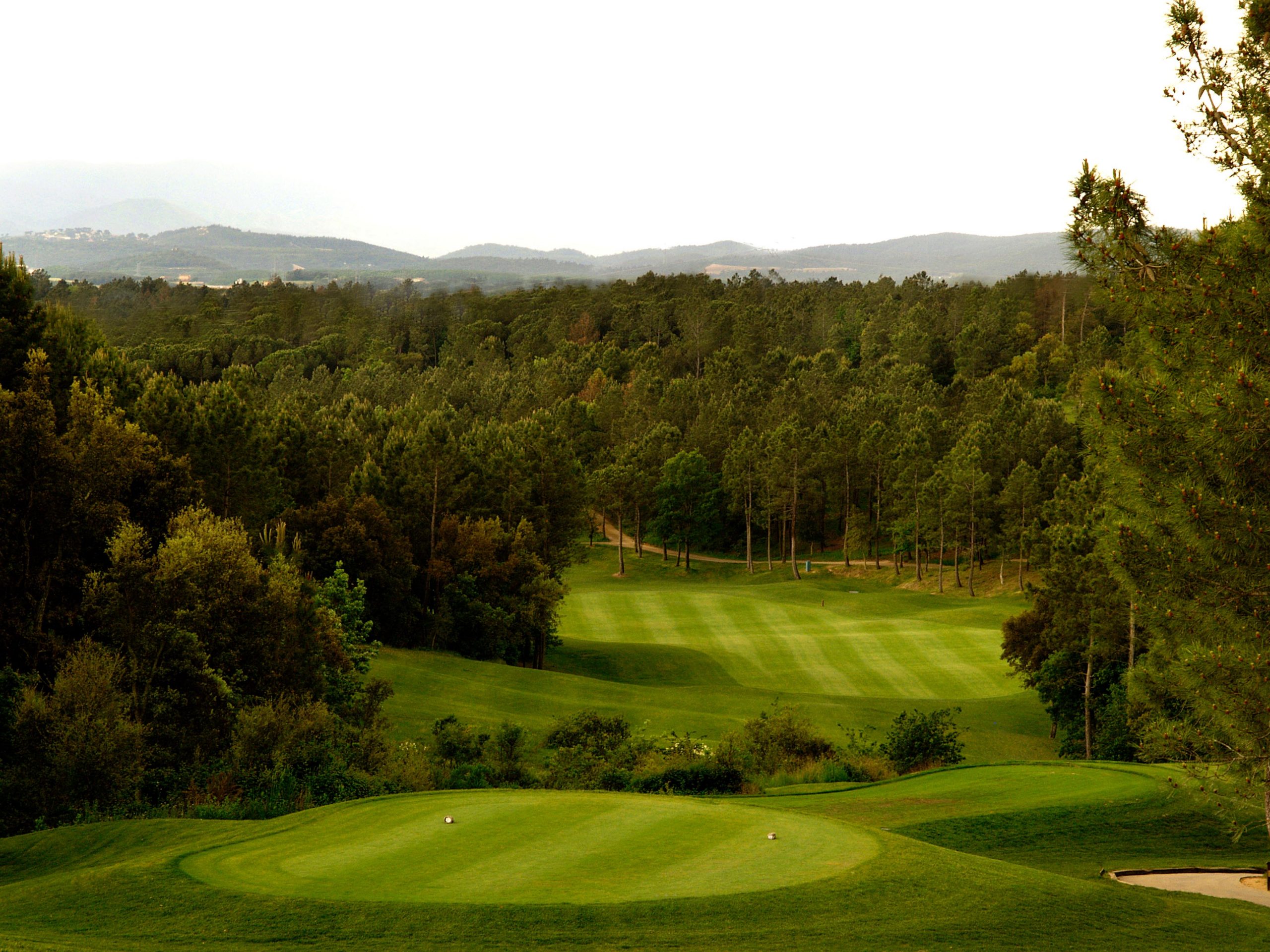 Tee perched above the fairway at PGA Catalunya Golf Resort, Costa Brava, Spain