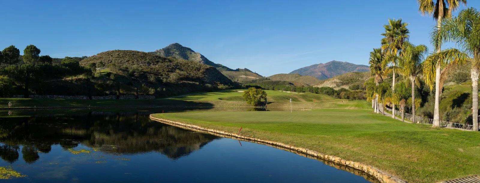 Across the water at Alferini golf course at Anantara Villa Padierna Palace Resort, Benahavis, Costa del Sol, Spain. Golf Planet Holidays