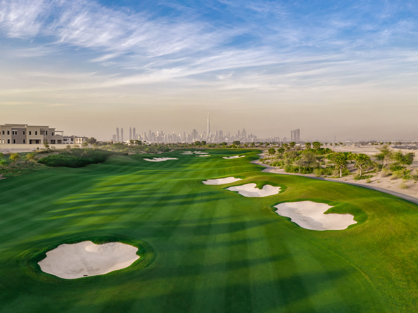 The city skyline behind Dubai Hills golf club