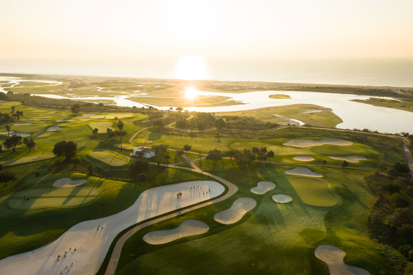 Sunrise over the River Formosa and Quinta da Ria Golf Club near Tavira, Algarve, Portugal
