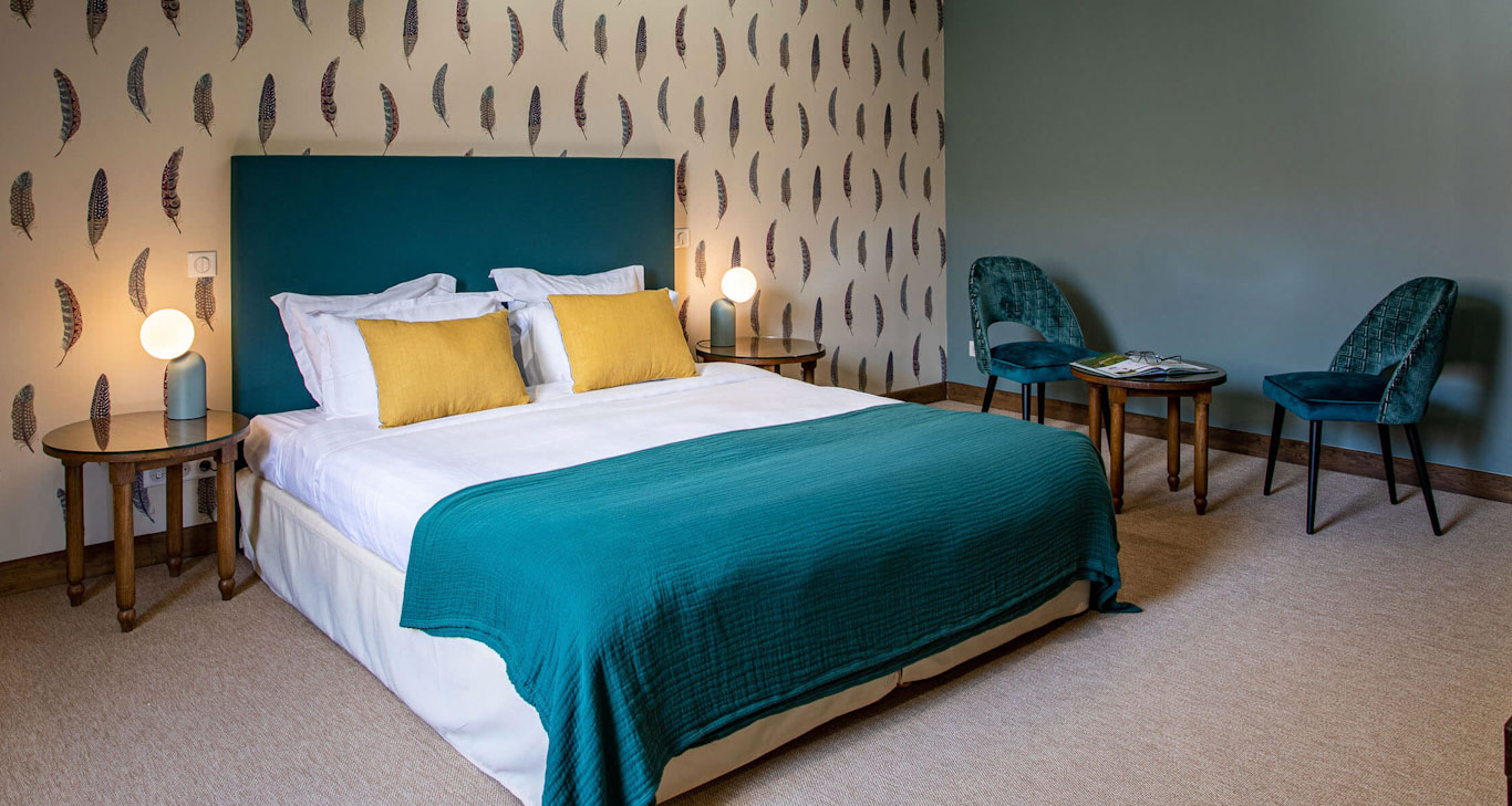 A bedroom at Domaine de Roncemay, Burgundy, France. Golf Planet Holidays