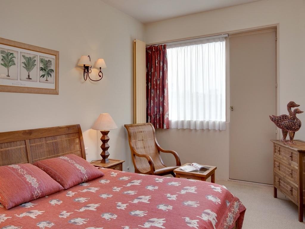 A comfortable double bedroom at Grand Hotel de Solesmes, Loire, France