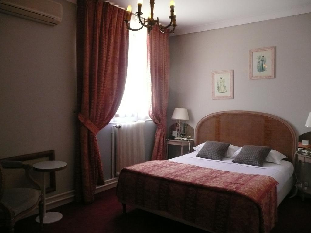 A double bedroom at Grand Hotel des Templiers, Reims, Champagne, France