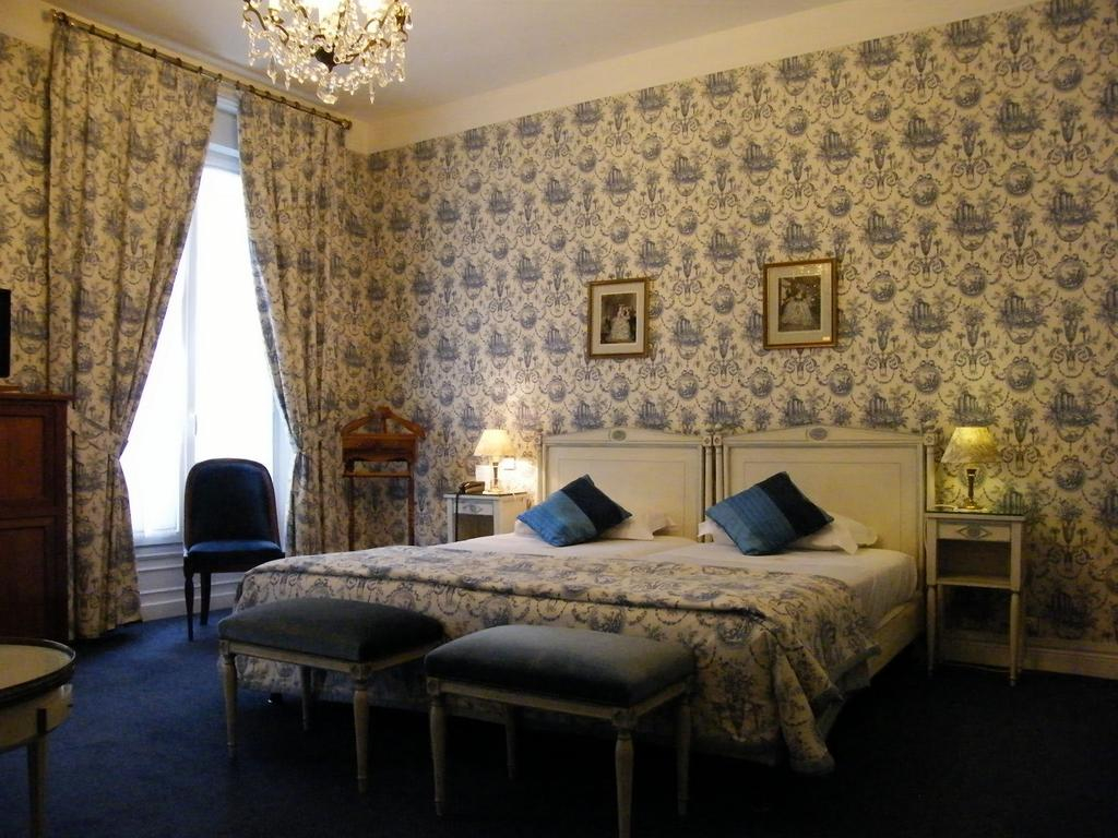 A double bedroom at Grand Hotel des Templiers, Reims, Champagne, France