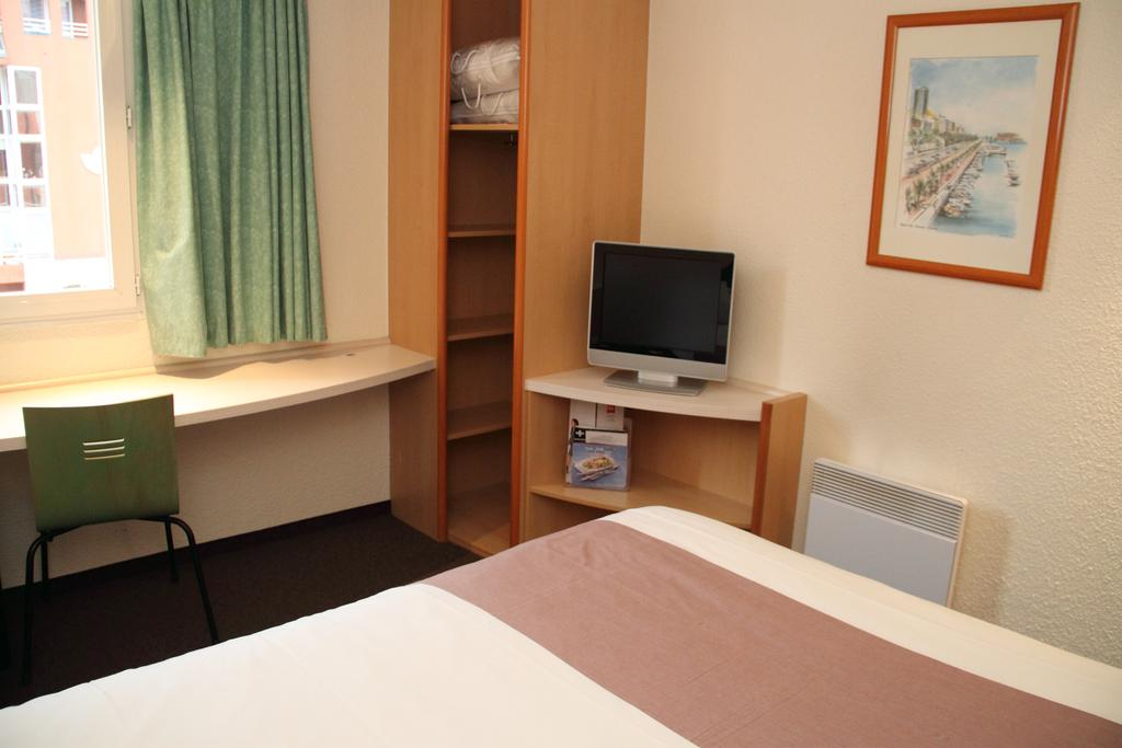 A double bedroom at Hotel Ibis Epernay Centre ville, Champagne, France