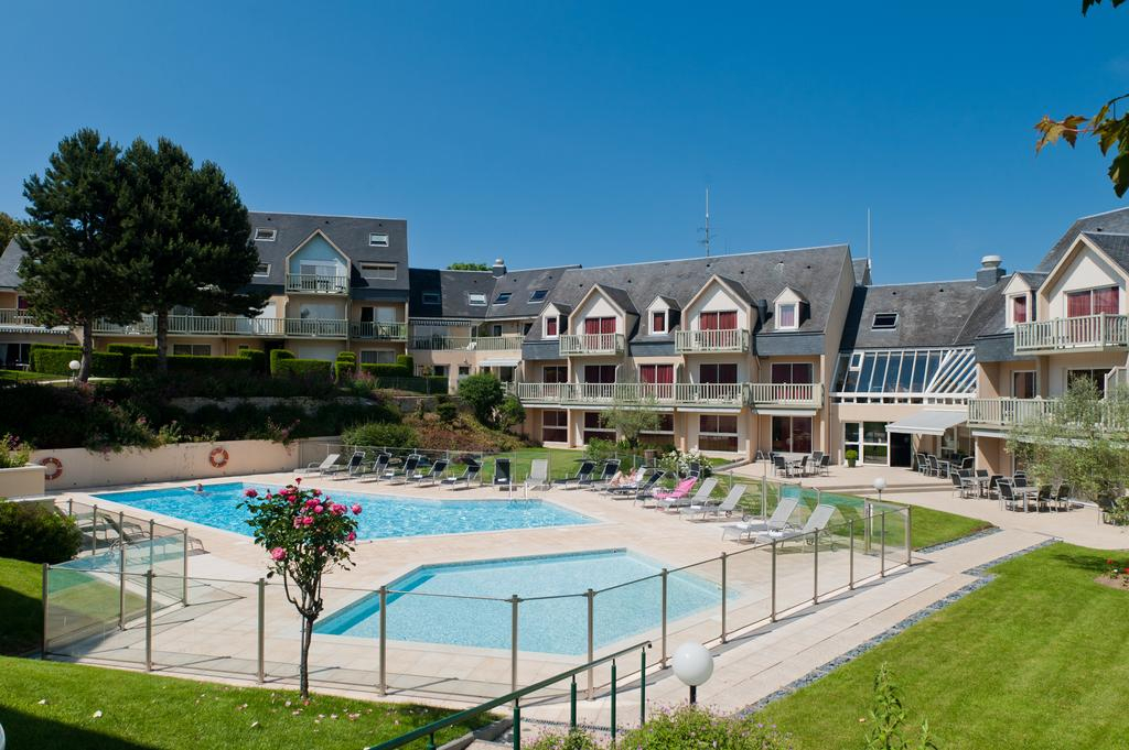 The pool area in the sun at the Mercure Omaha Beach, Port en Bessin, Normandy, France