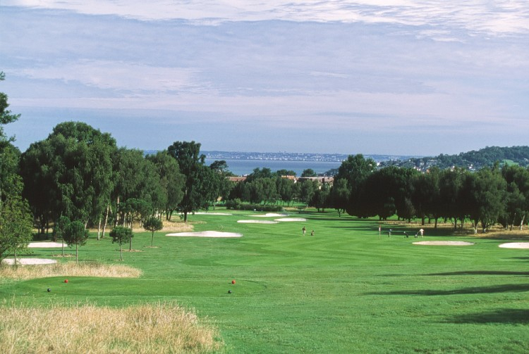 Heading down the fairway on the red and white course at New Golf Deauville, Normandy, France