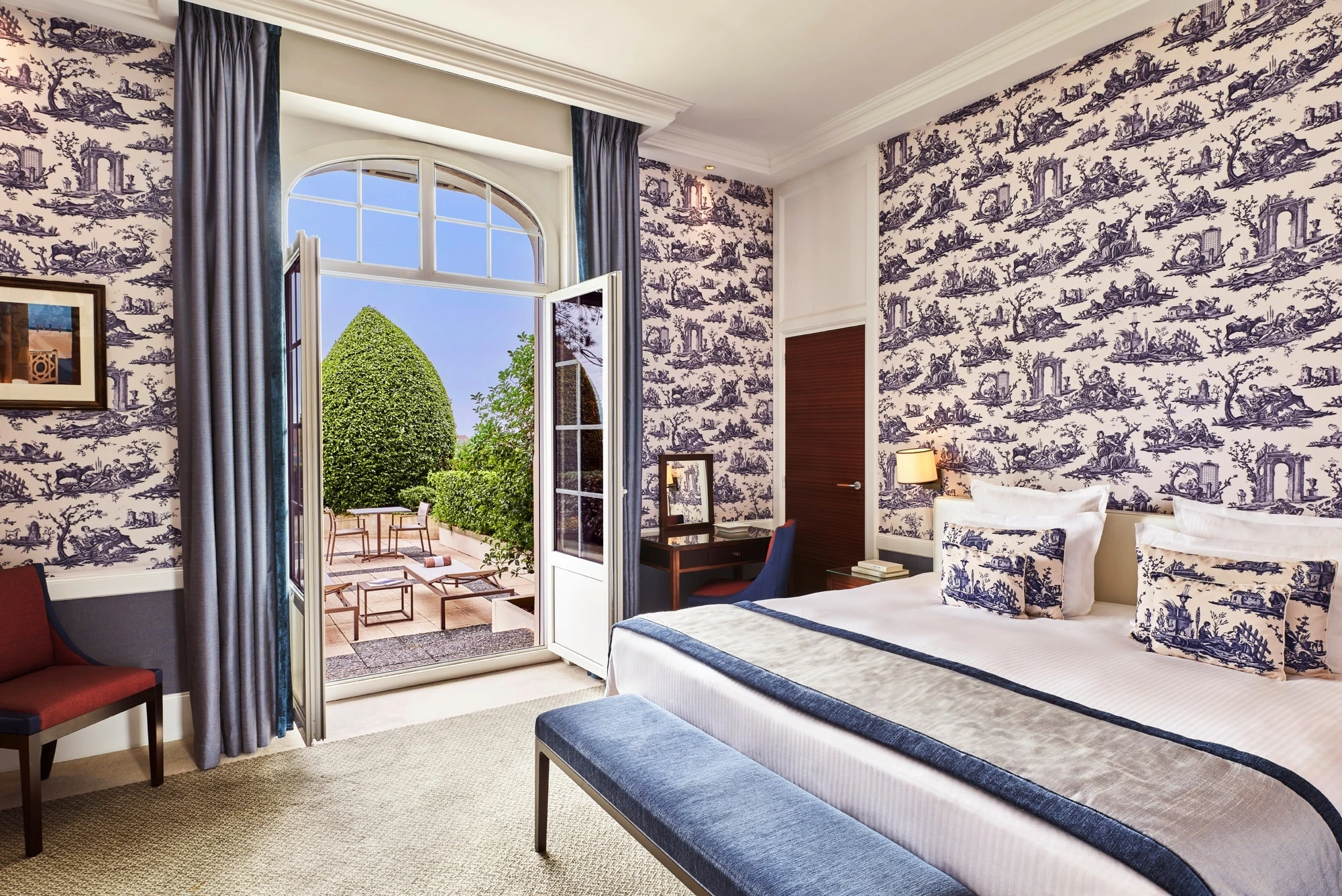 A large double bedroom with private terrace at Normandy Barriere Hotel, Deauville, France. Golf Planet Holidays.