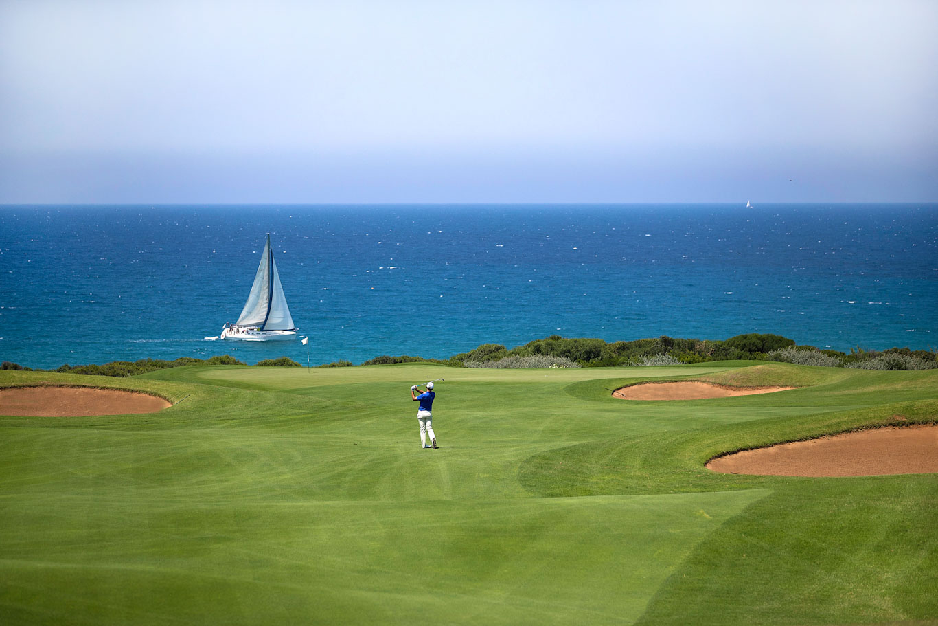 Playing to the green on The Dunes course at Costa Navarino, Greece
