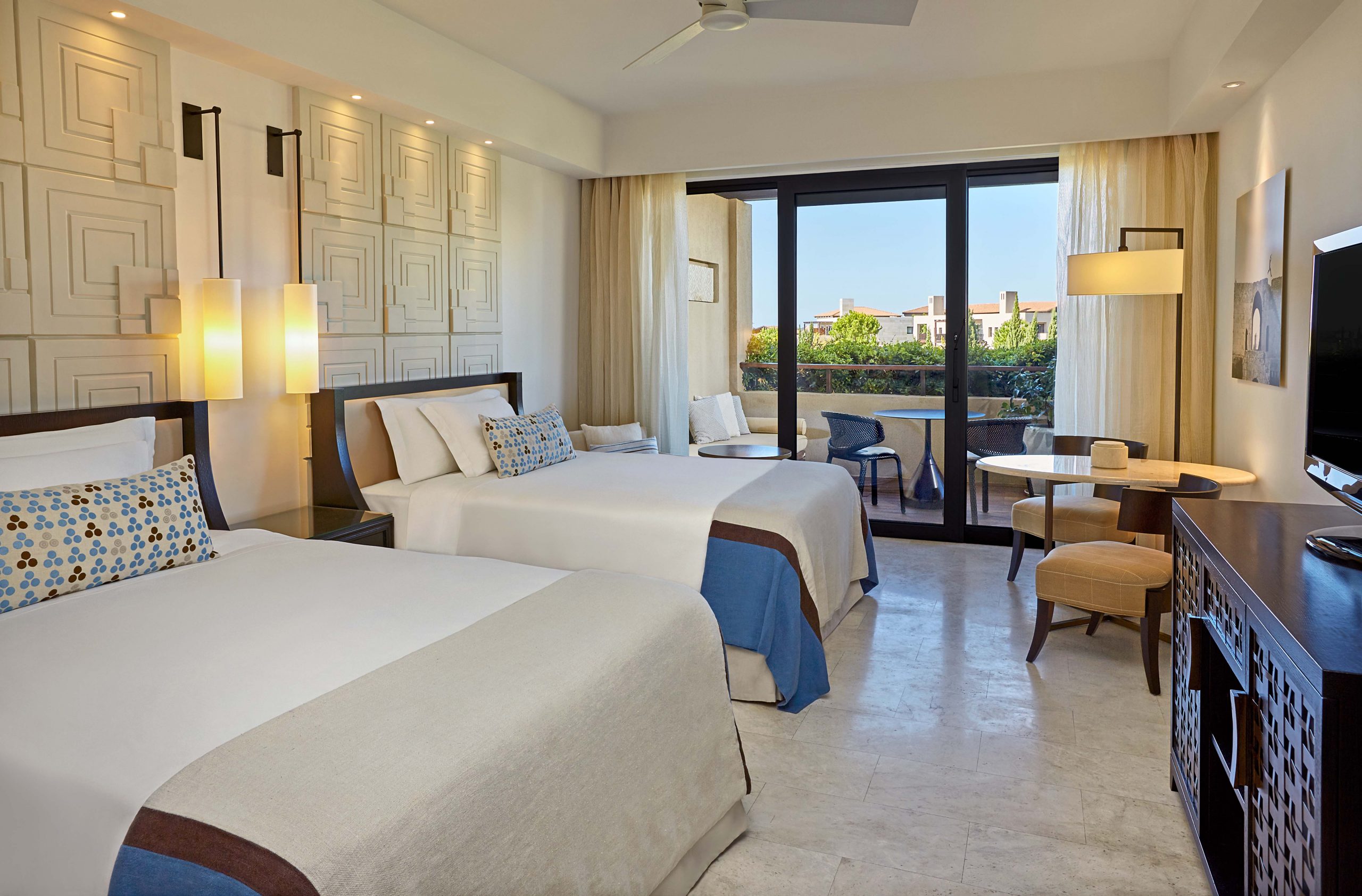 A luxury twin bedroom at The Romanos Costa Navarino, Greece