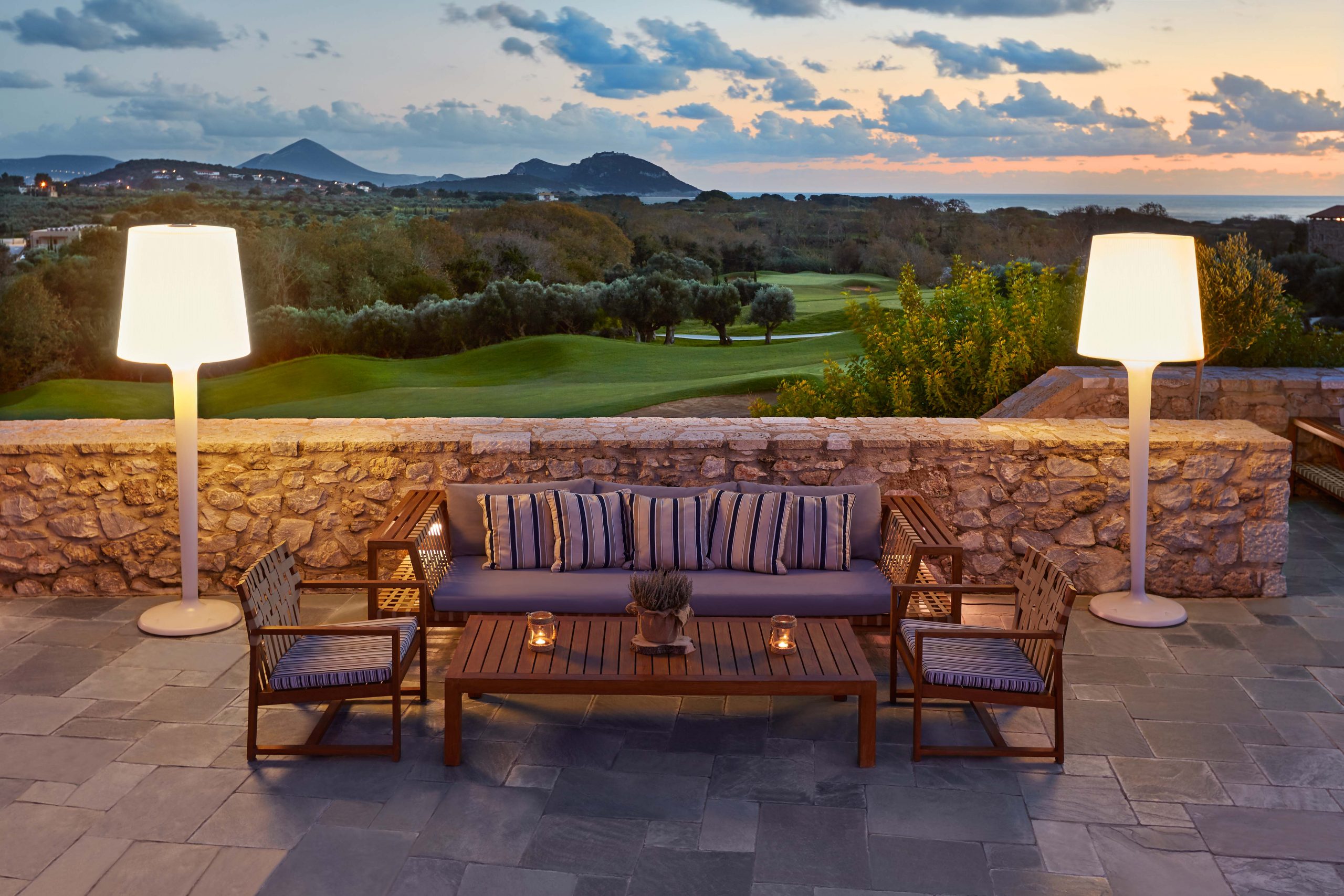 Enjoy a drink on the terrace at Flame, the steak restaurant at Westin Resort, Costa Navarino, Greece