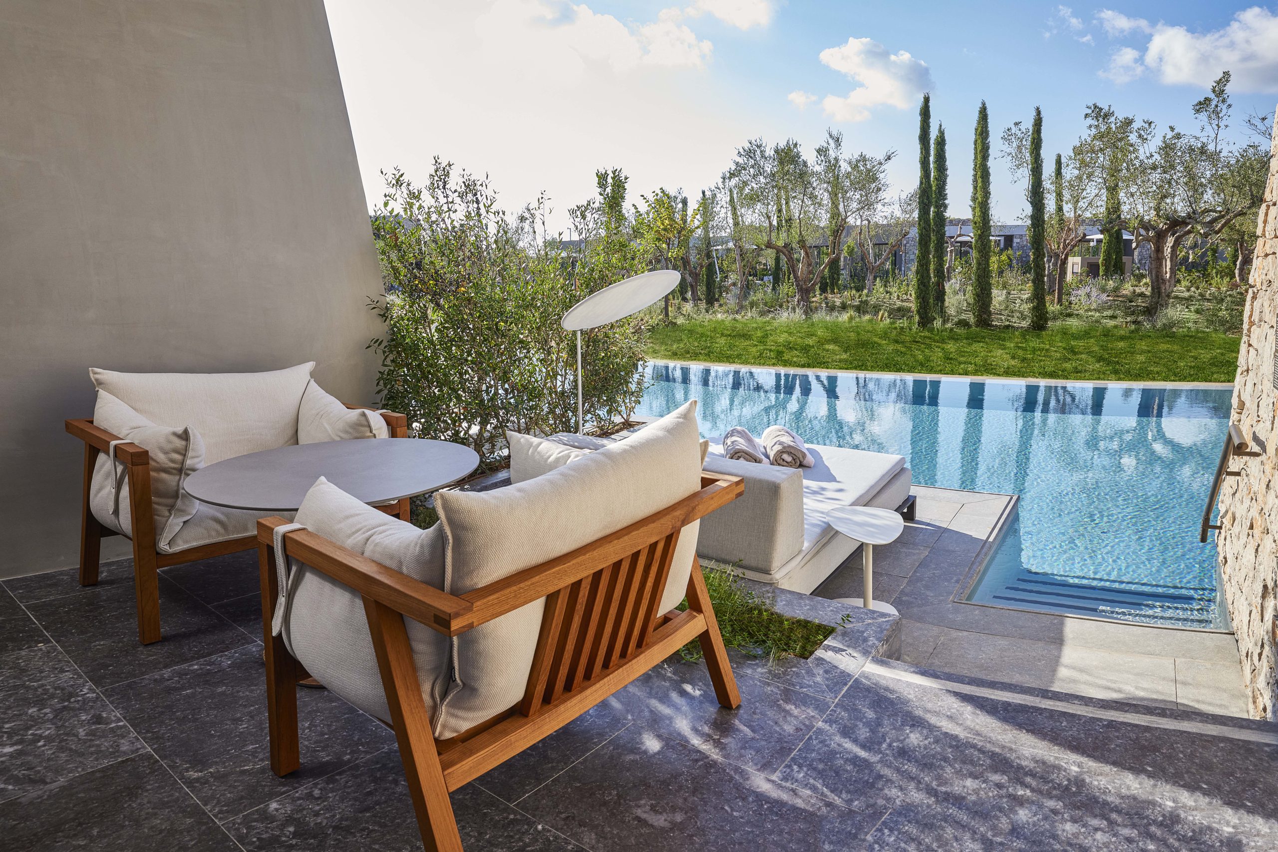 View over an infinity pool at W Costa Navarino, Greece. Golf Planet Holidays.