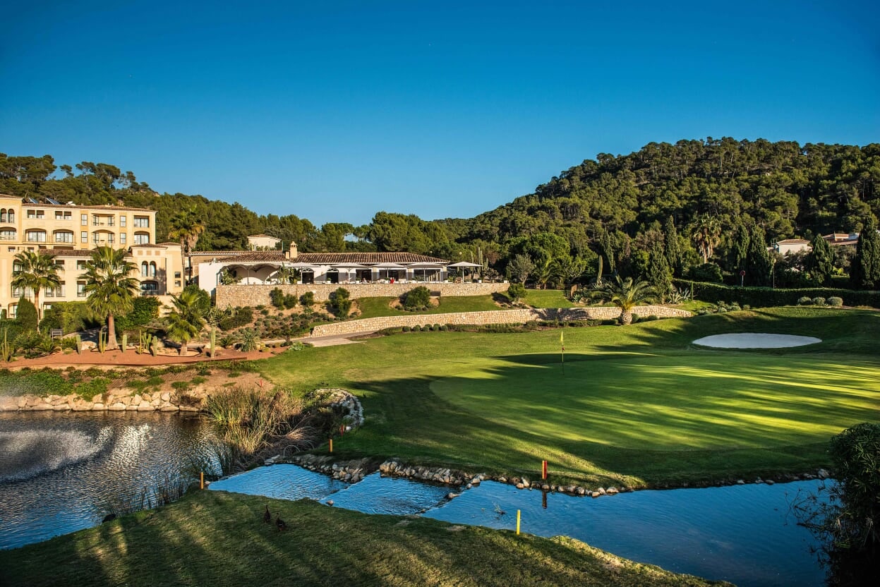 Water surrounds the 18th green at Golf de Andratx, Mallorca. Golf Planet Holidays
