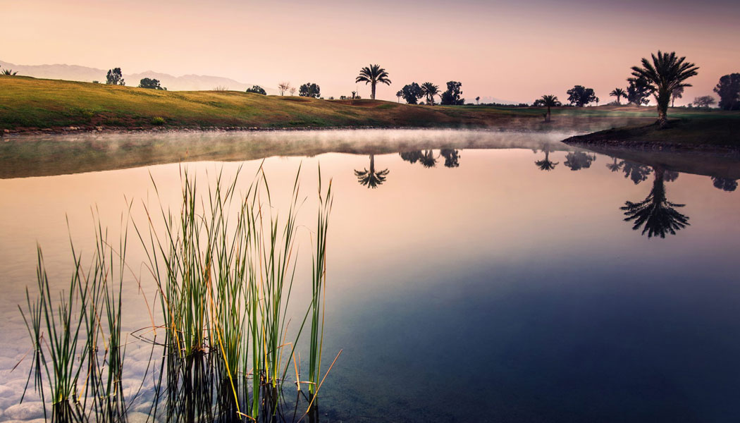 Reflections over the water at Amelkis Golf Club, Marrakech, Morocco