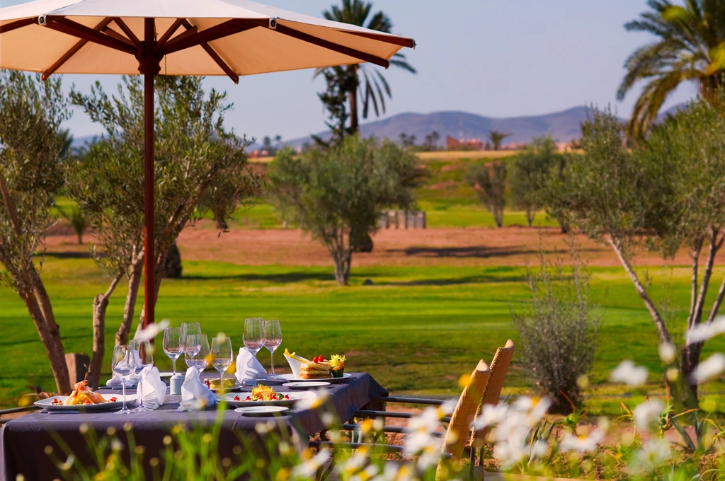 Al fresco lunch at Pickalbatros Hotel du Golf Marrakech Palmeraie Morocco. Golf Planet Holidays.