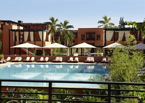 By the pool at Hotel and Ryads Barriere Le Naoura, Marrakech, Morocco