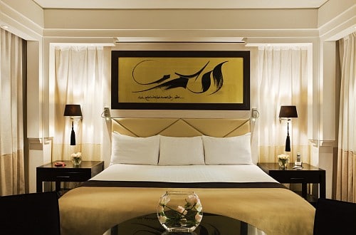 A luxury double bedroom at Hotel and Ryads Barriere Le Naoura, Marrakech, Morocco