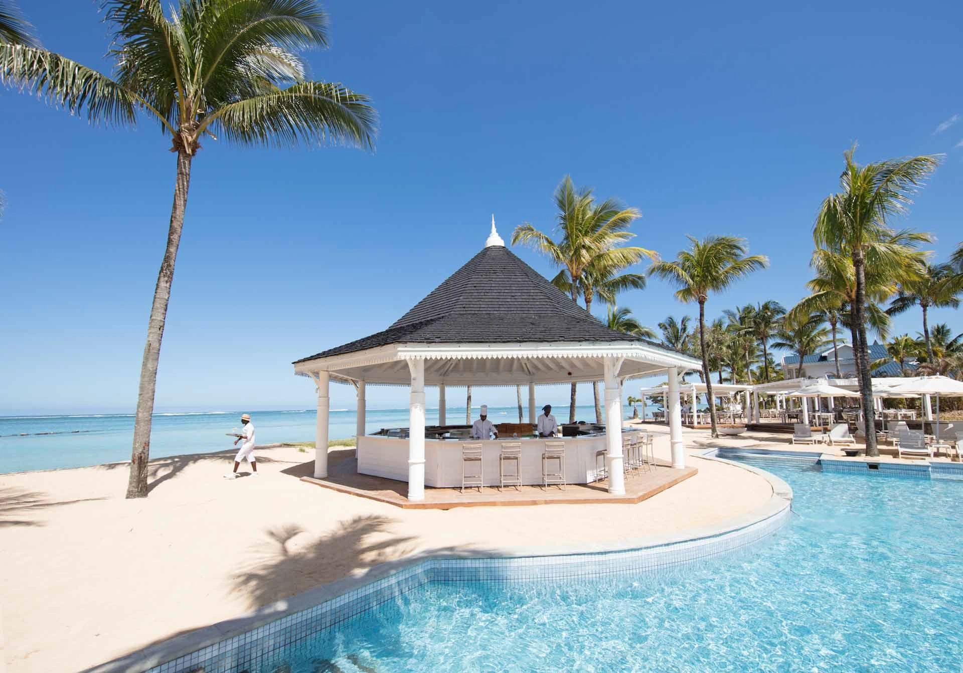 Pool view at Heritage Le Telfair Golf and Wellness Resort, Mauritius. Golf Planet Holidays.