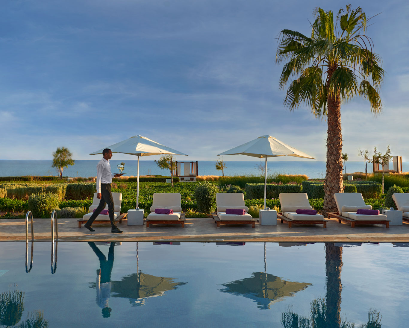 Waiter service by the pool at Hyatt Place Hotel, Taghazout Bay, Agadir, Morocco