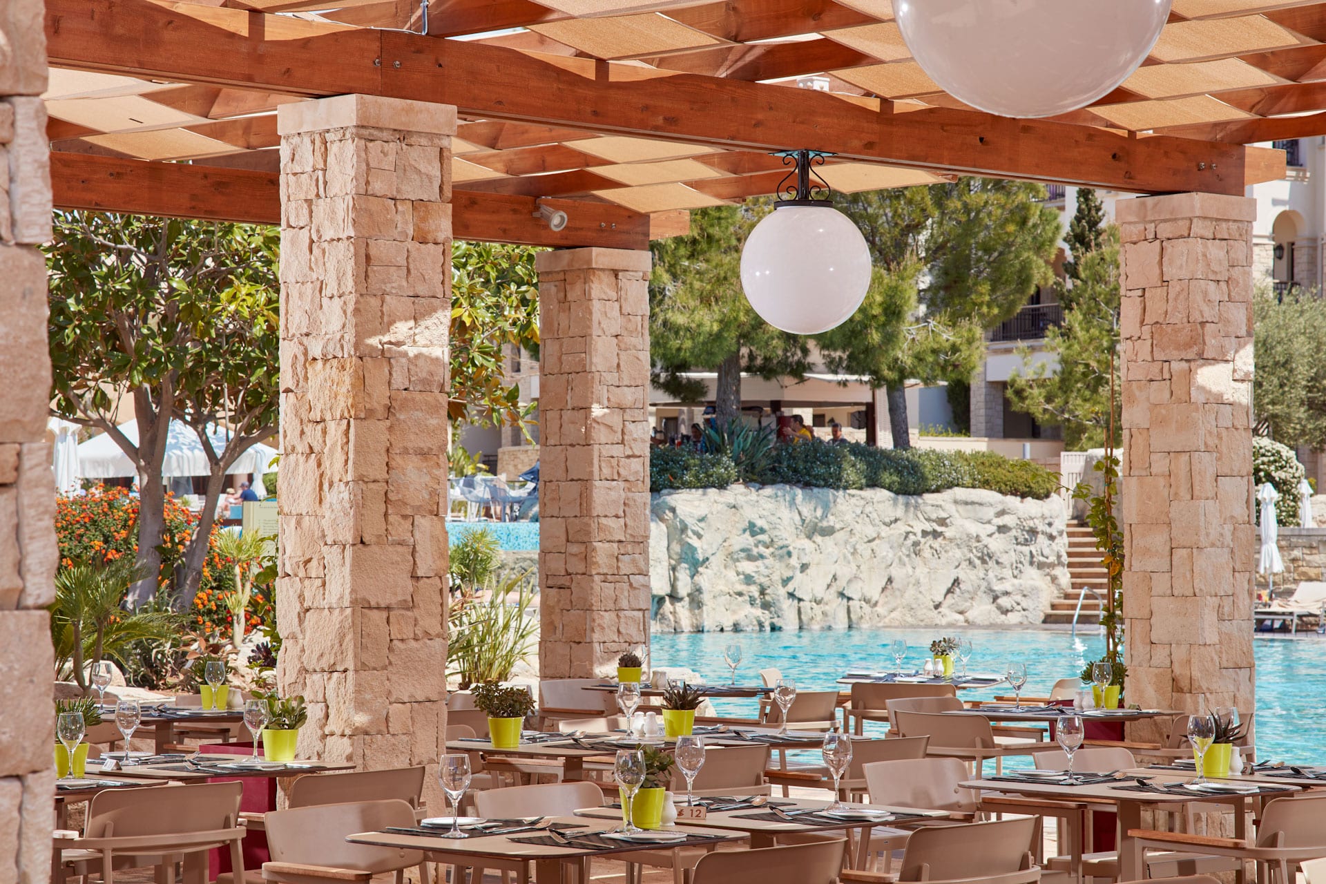 Dine by the pool at Aphrodite Hills Hotel by Atlantica, Paphos, Cyprus