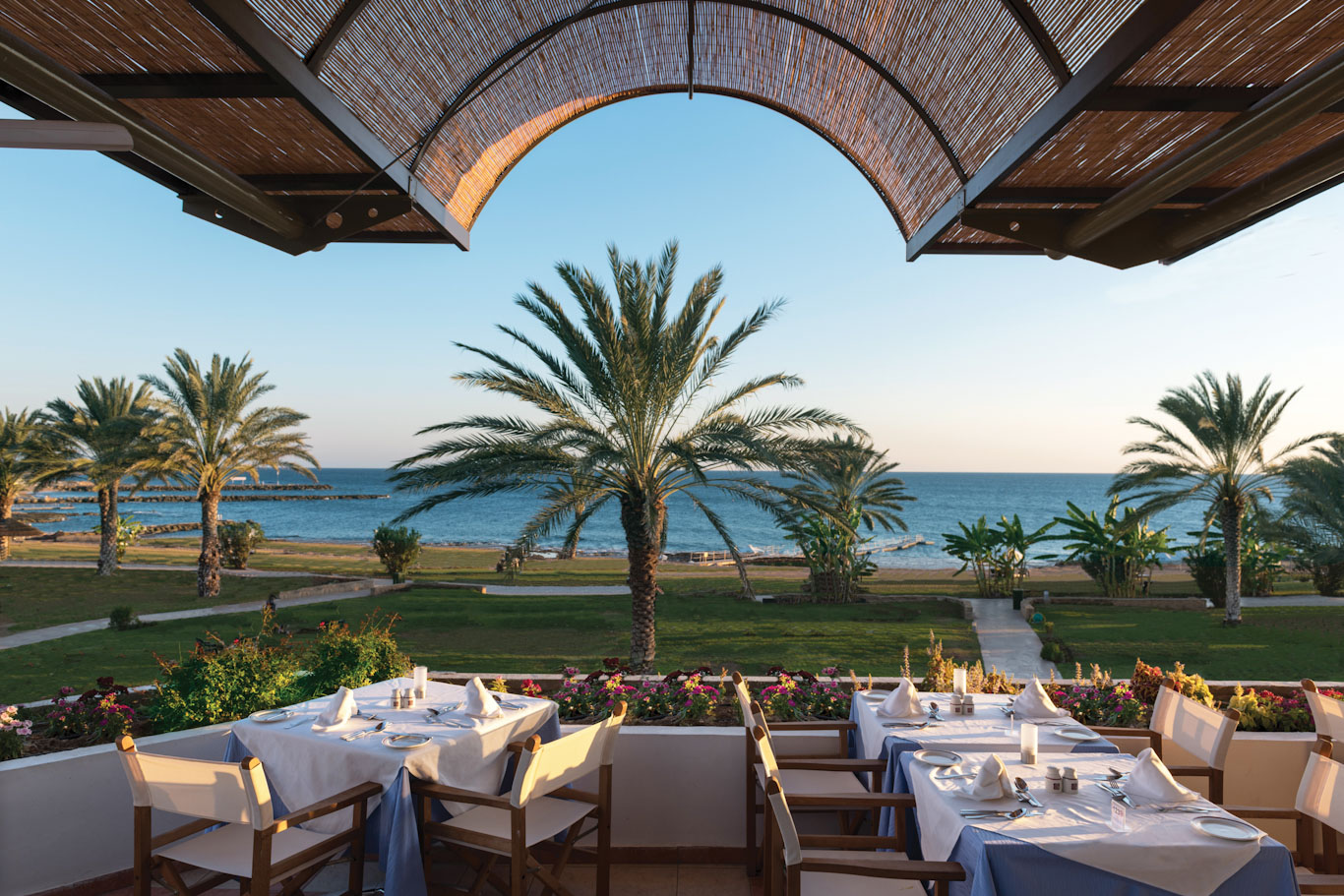 Dine on the terrace overlooking the ocean at Constantinou Bros Athena Royal Beach Hotel Paphos, Cyprus
