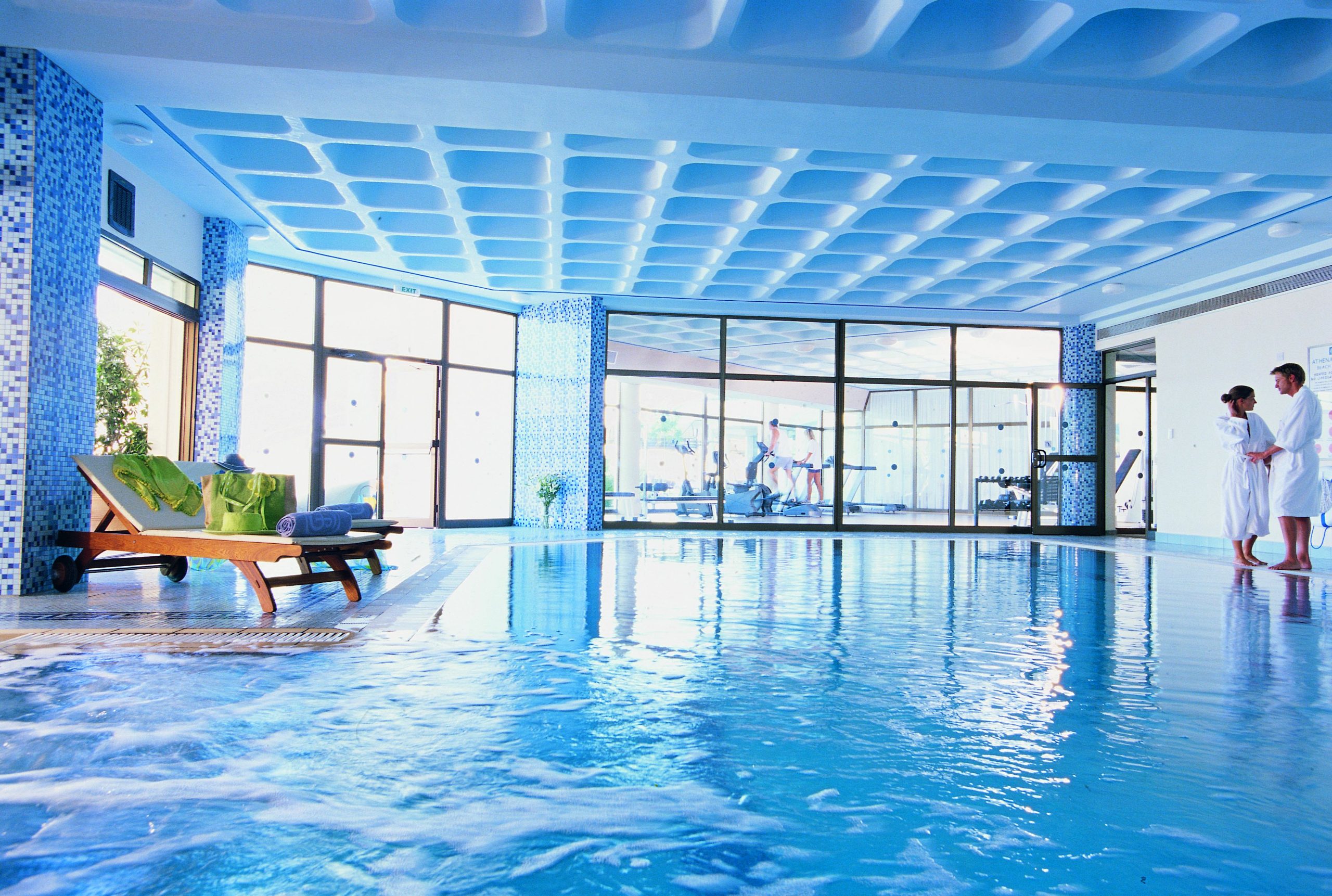Enjoy the indoor pool and gym at Constantinou Bros Athena Royal Beach hotel Paphos, Cyprus