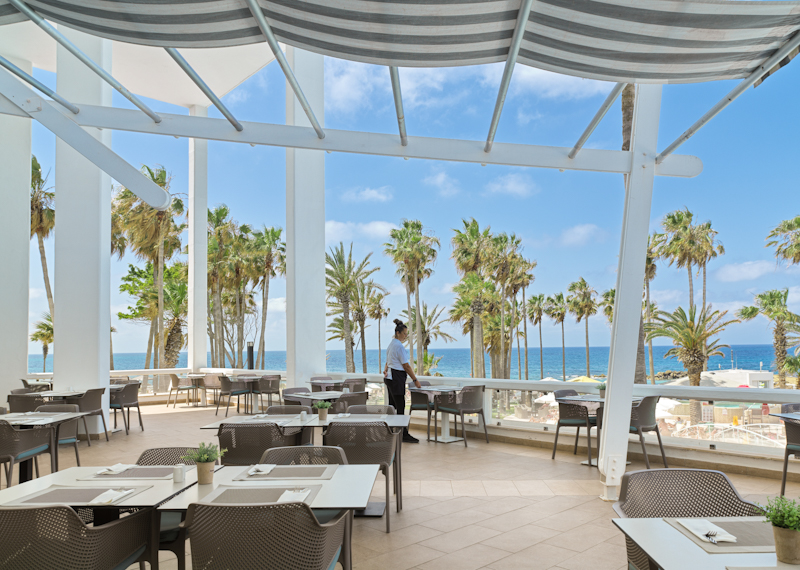 Beachside dining at the Cypria Maris Beach Hotel and Spa, Paphos, Cyprus. Golf Planet Holidays.