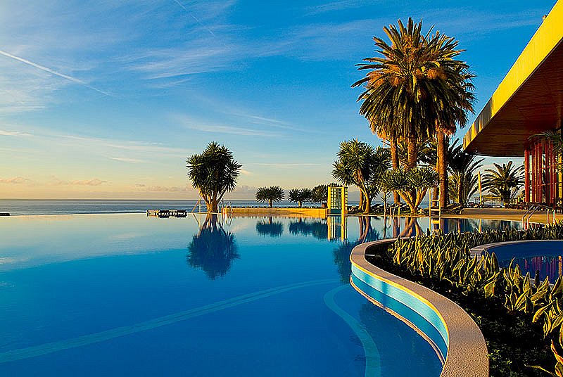 Sunset over the pool at Pestana Casino Park hotel Madeira