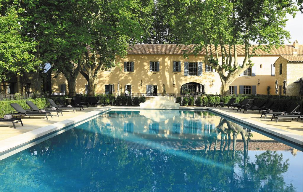 By the pool at Domaine de Manville, Les Baux de Provence, France. Golf Planet Holidays.