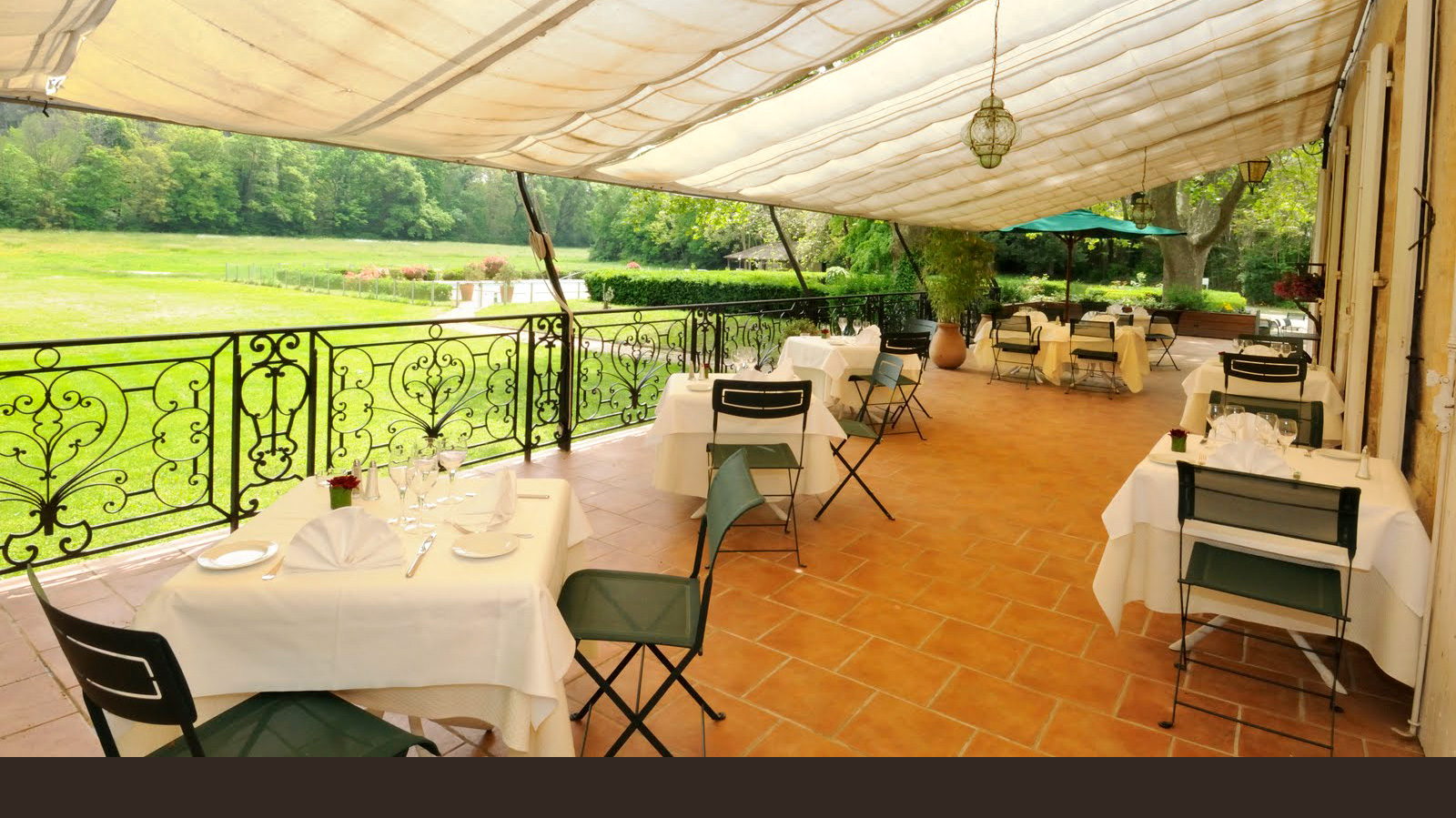 Dining on the terrace at Moulin de Vernegues, Mallemort, France