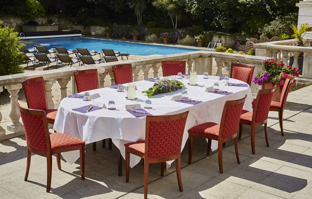 Dine by the outdoor heated pool at The Grand Hotel Eastbourne, England