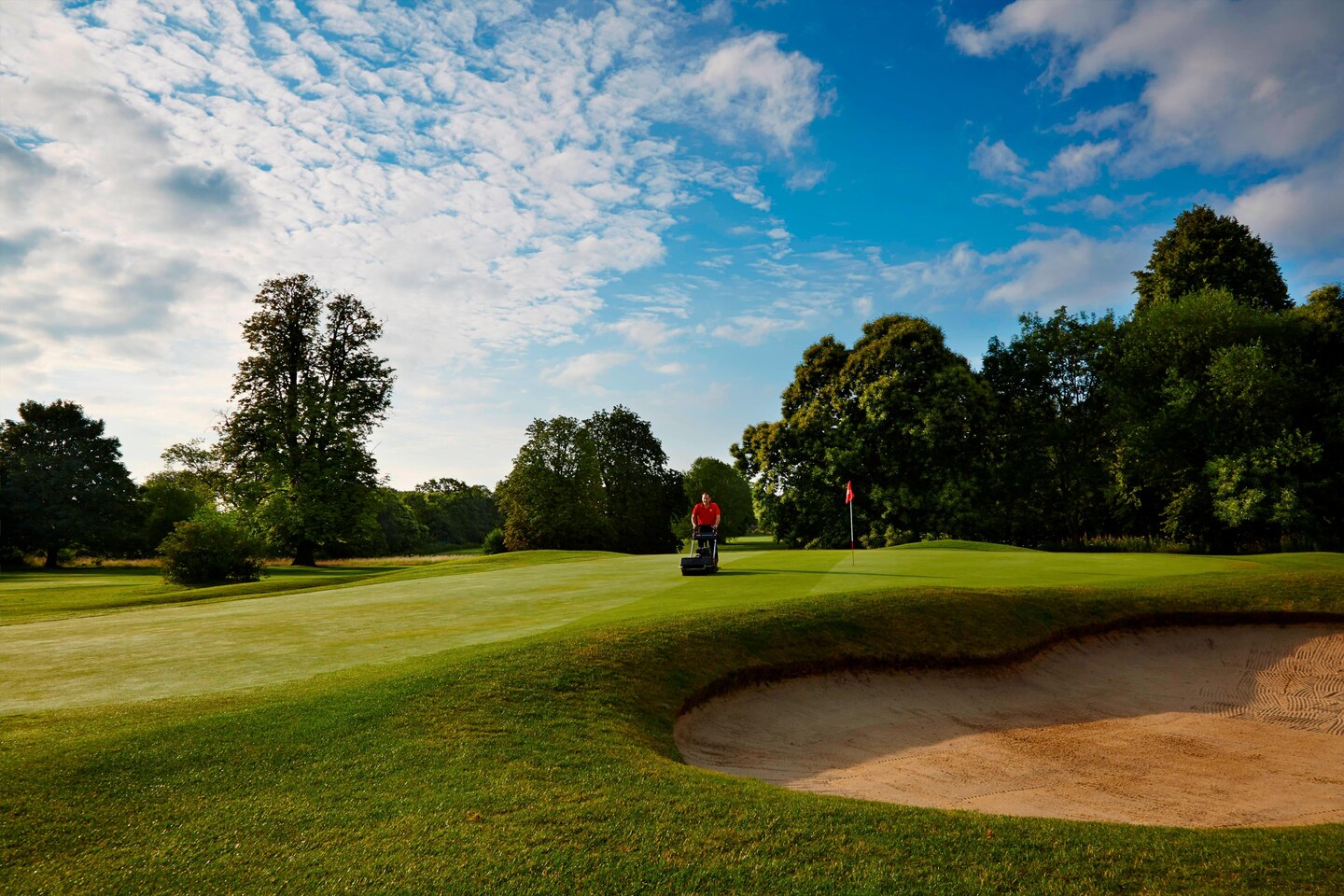 Mowing the 12th green at St Pierre Old course, Chepstow, England