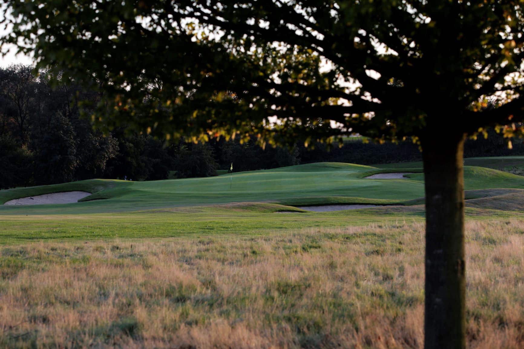 Through the trees to the green at Pierpont Golf Club, near Waterloo, Belgium