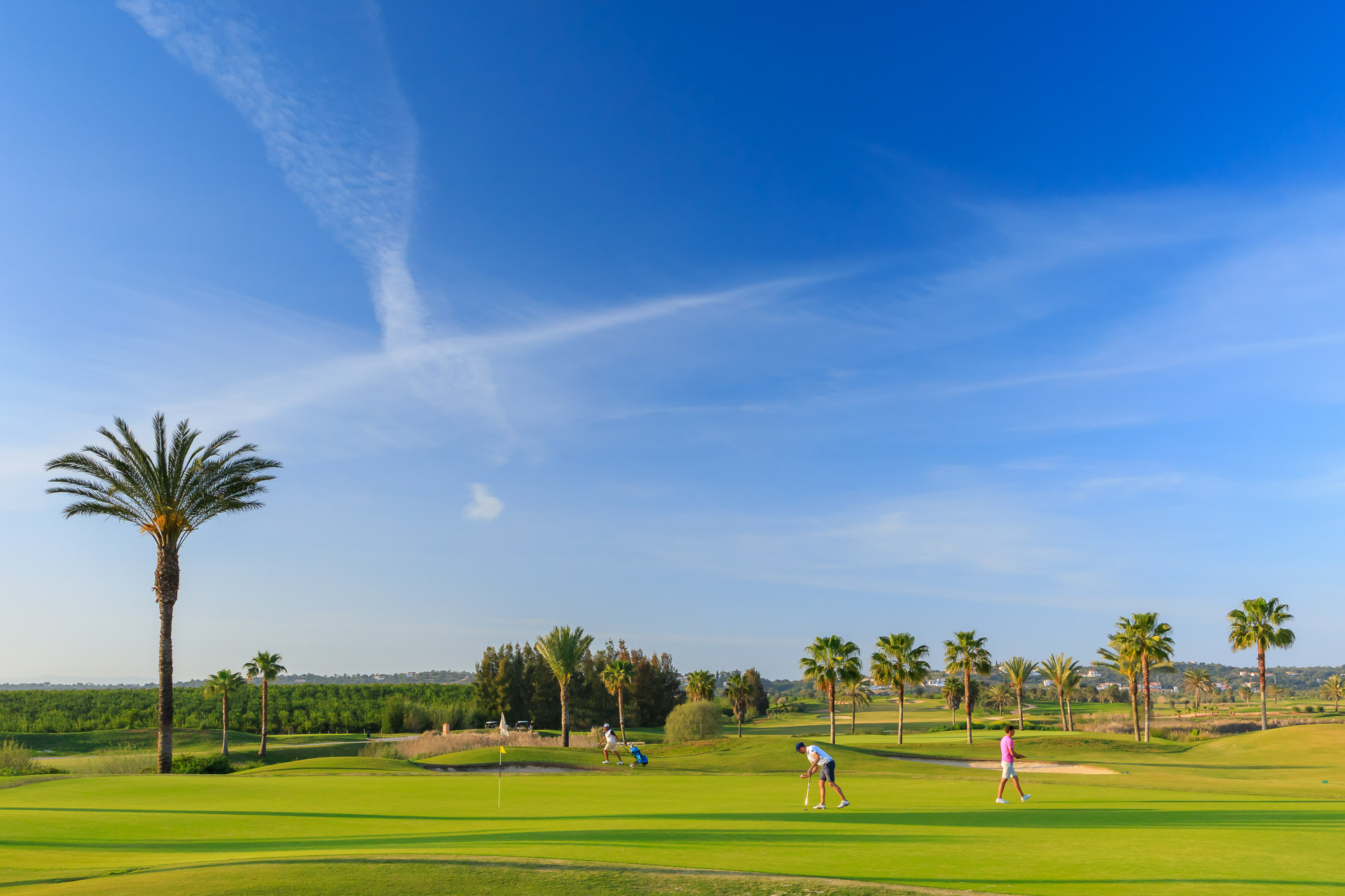 Playing in a beautiful setting at O'Connor Junior Golf Course, Amendoeira Golf Resort, Algarve, Portugal. Golf Planet Holidays.
