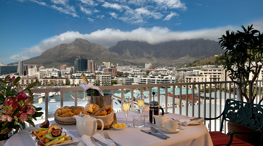 Breakfast on the balcony at The Commodore Hotel, Cape Town, South Africa. Golf Planet Holidays.