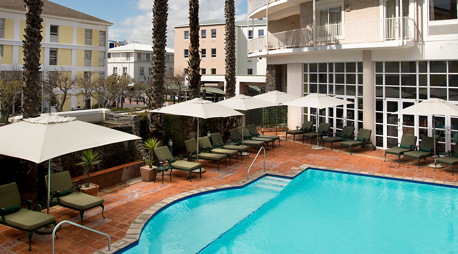 The outdoor swimming pool at The Commodore Hotel, Cape Town, South Africa. Golf Planet Holidays.